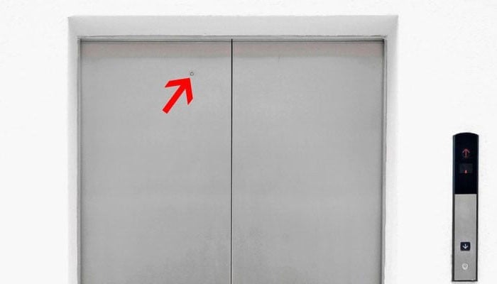 Do you know why there is a small hole in the elevator door?