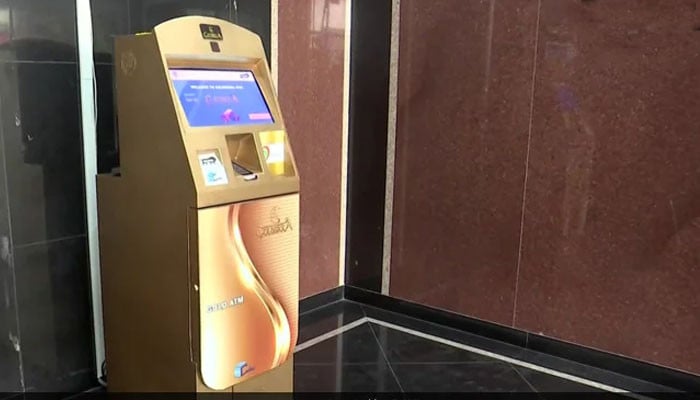 An ATM machine that dispenses gold coins to citizens instead of cash