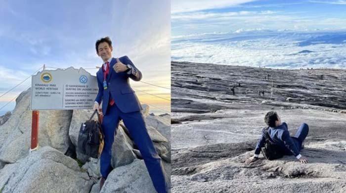 A person who climbs a mountain of 4 thousand 100 meters in a three-piece suit